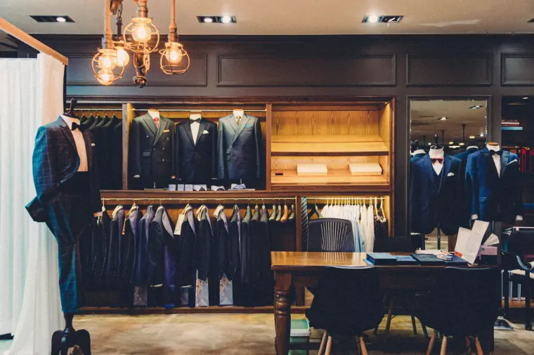 Tailored suits on display in a menswear store