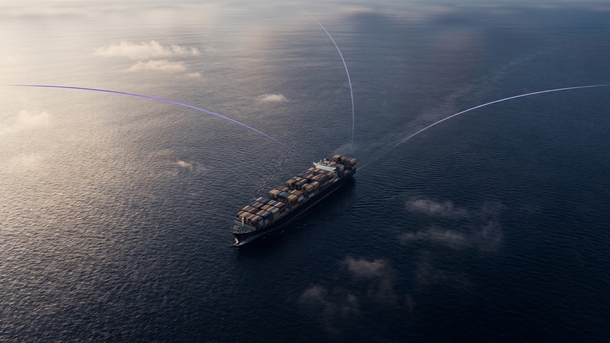 A container ship on open ocean at dawn with three faint route lines arcing toward different horizons