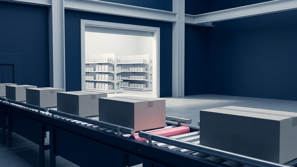 Unbranded retail cartons move from a receiving line toward stocked shelves beneath a pink cost-relief light