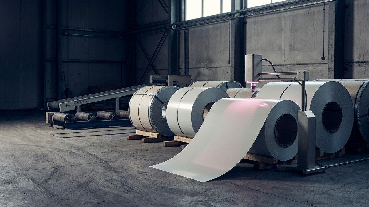 Coated flat-steel coils and a blank inspection station in a generic industrial receiving bay.