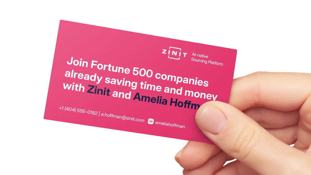 A hand holding a raspberry Zinit business card. The name and contact details on the card belong to a placeholder person, not a Zinit employee.